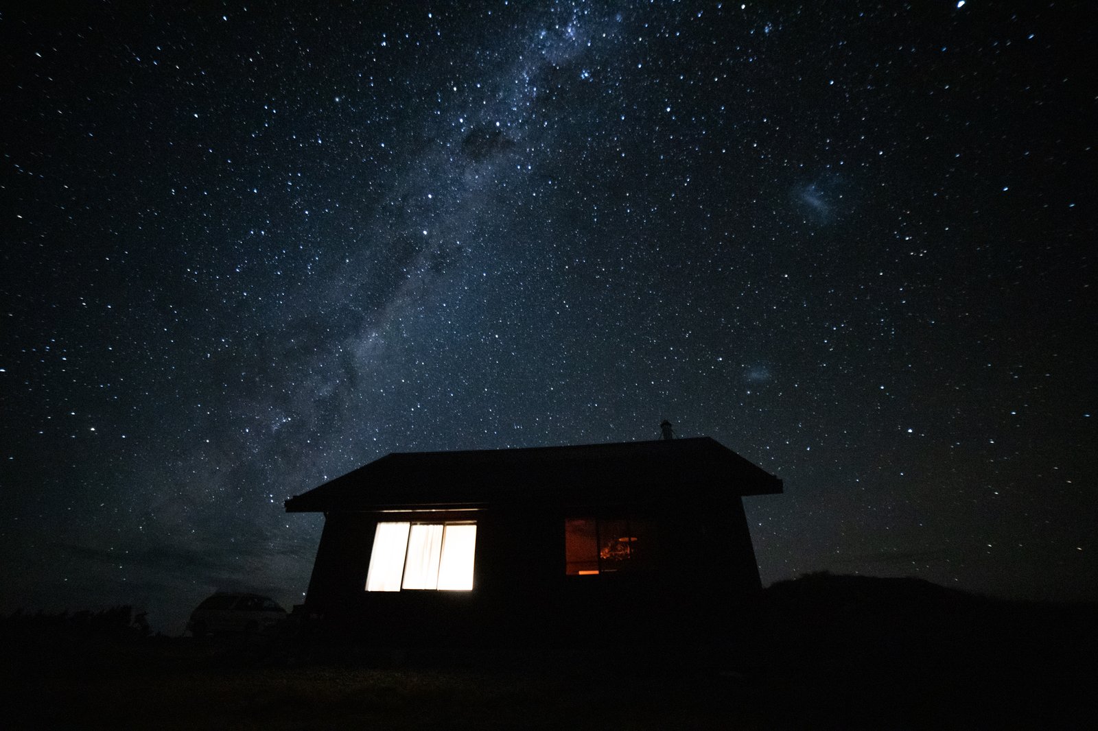 High Country Cabin surrounded by the Southern Alps under a clear sky